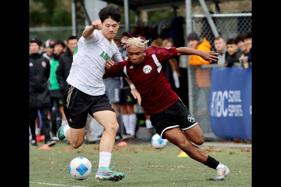 Burnaby North Vikings forward Koben Armer Petrie battles an Argyle Pipers defender in the second half of their BC boys AAA high school provincial championship match, Saturday at the Burnaby Lake Sports Complex West.