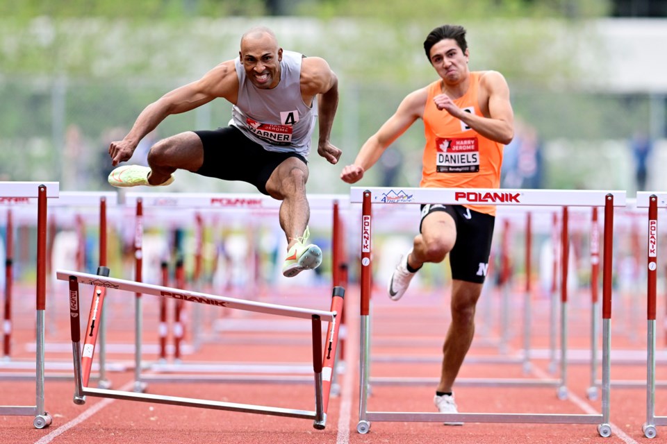 Canadian Olympic champion Damian Warner (left) races during the Men's International 110-metre hurdles at the 2022 Vancouver Sun Harry Jerome Track Classic at Swangard Stadium. 