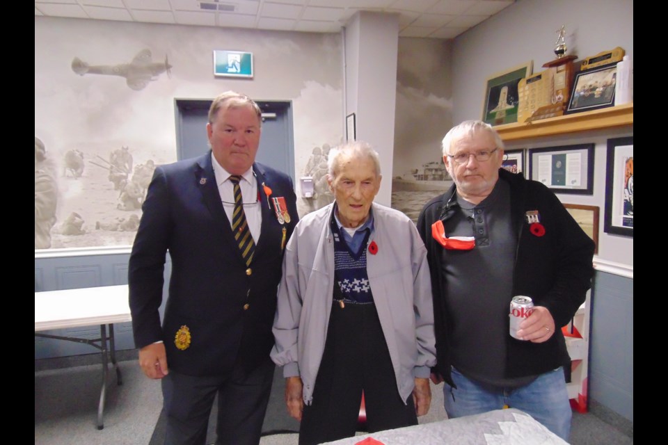 Bill Kalbhenn, from left, second vice chairman and veteran service officer at the Hespeler branch of the Royal Canadian Legion, WW2 veteran, Eugene Beaver, and president of the Hespeler Branch of the Royal Canadian Legion, Harry Boomer.                            