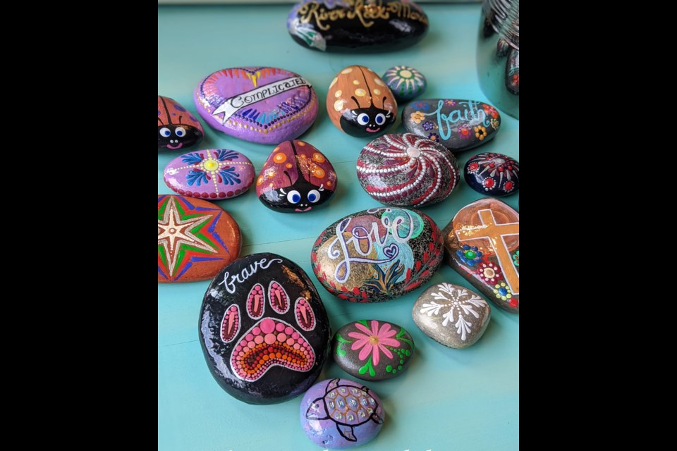 Artist Sindhu Nagaraju from Cambridge paints each rock free hand using bright colours.