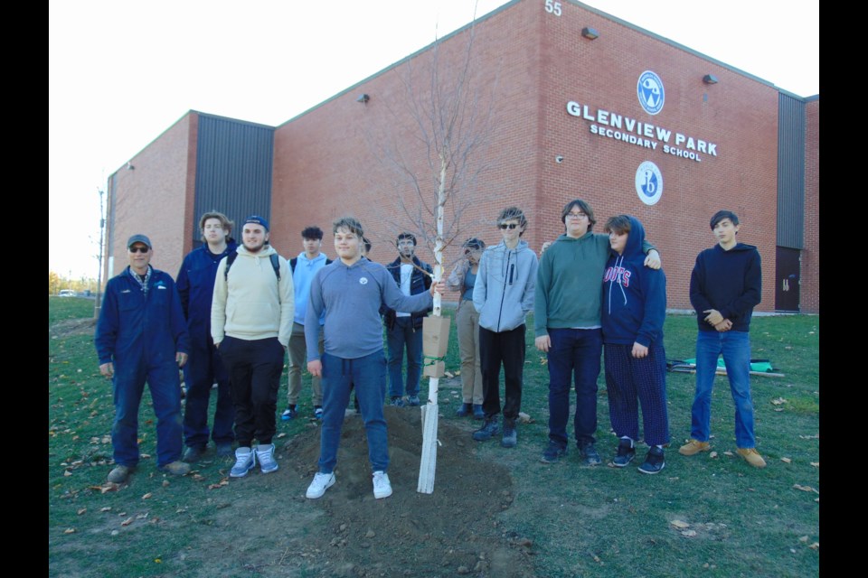 (left to right) Glenview Park Secondary School teacher Mr. Eckhard Lutz with his students after planting 13 trees at the school on Tuesday.                                