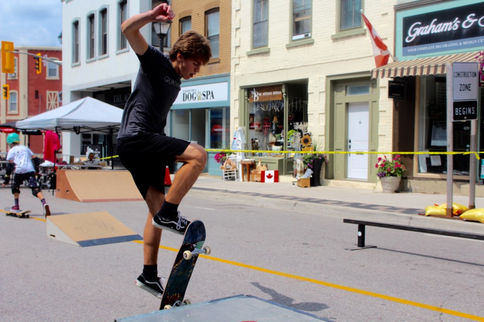 A skateboarder attempts a trick on Queen Street during the Hespeler Needs a Skatepark event