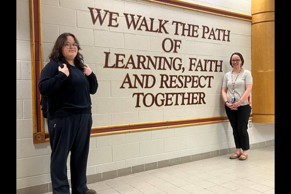 Evy Ayers (left) and teacher Anne Denomme are part of the World Religions course at Monsignor Doyle Catholic Secondary School that shared messages of support after an act of vandalism at the Islamic Centre of Cambridge last month.