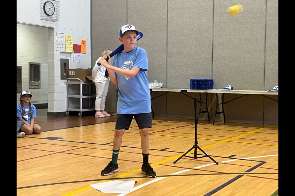 Grayson Moore gets ready to take a swing during the final day of activities as part of an eight week program at Moffat Creek Public School sponsored by the Jays Care Foundation.