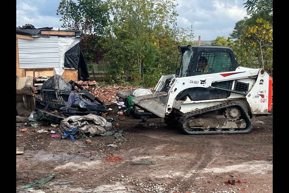 The city's efforts to clean up garbage at the encampment was underway Wednesday afternoon.