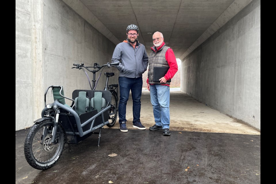 Mark Longo and Ward 4 councillor Ross Earnshaw stand in the newly finished pedestrian tunnel at the Beverly Street underpass.