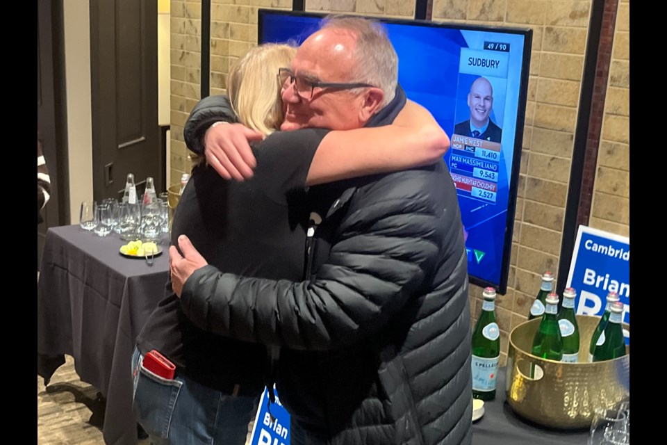 Cambridge MPP Brian Riddell is embraced following the announcement that he'd been reelected as Cambridge MPP.