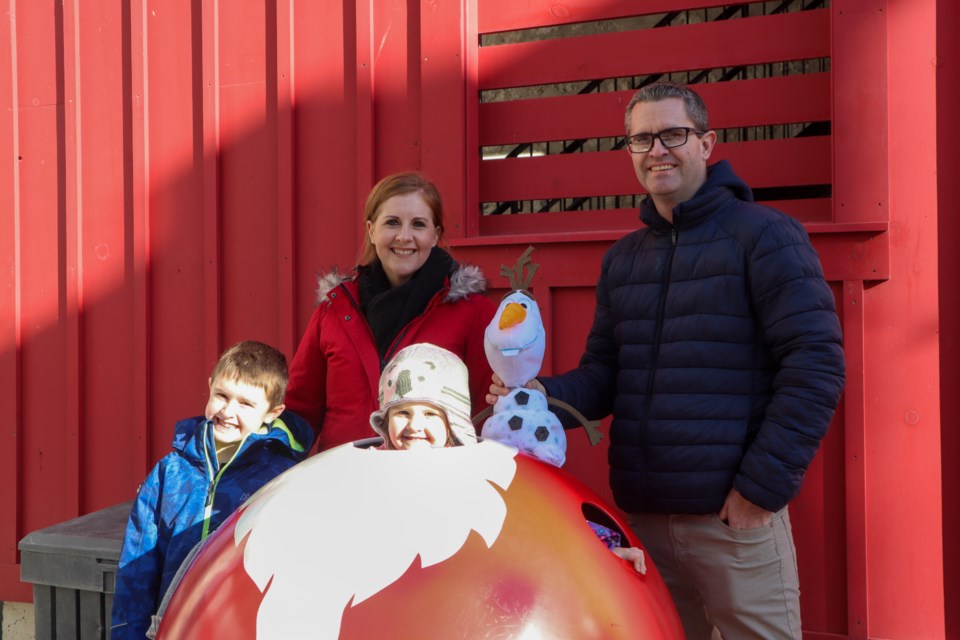 The Glass Family came out to get a photo with Santa and enjoy the holiday themed decor at the Gaslight District's Holiday Market, which runs through Dec. 17.