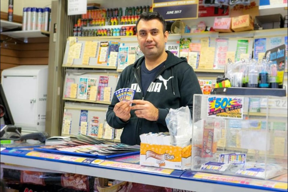 Seyed Jalali stands behind his counter at Mr. Convenience Too.