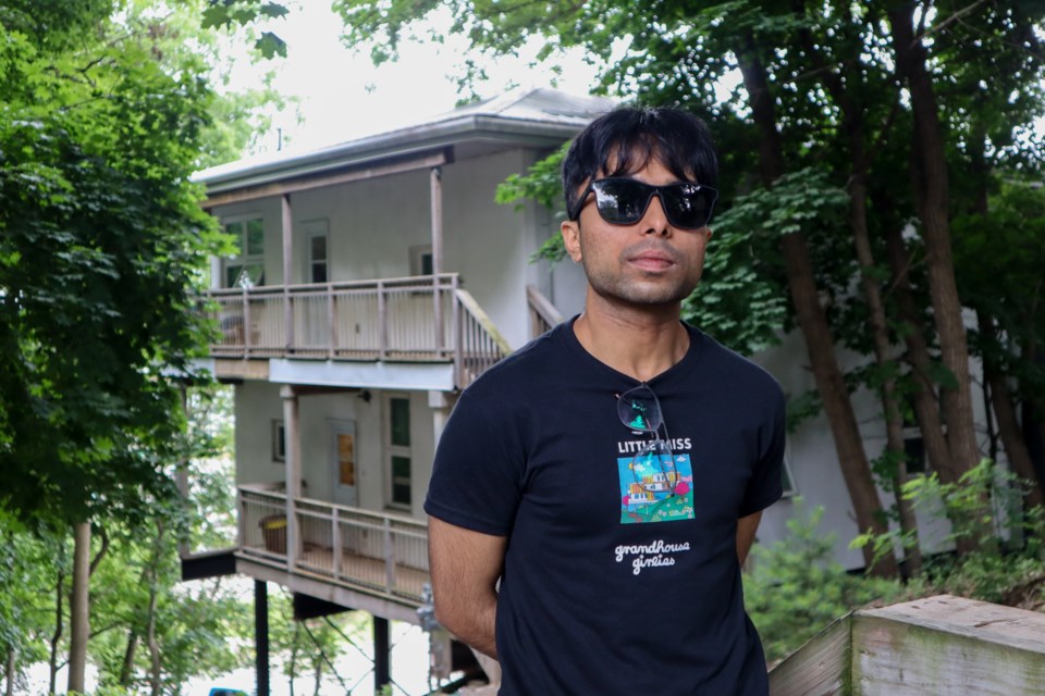 Manav Aggarwal the Grand House "Don" stands in front of the home on Roseview Avenue