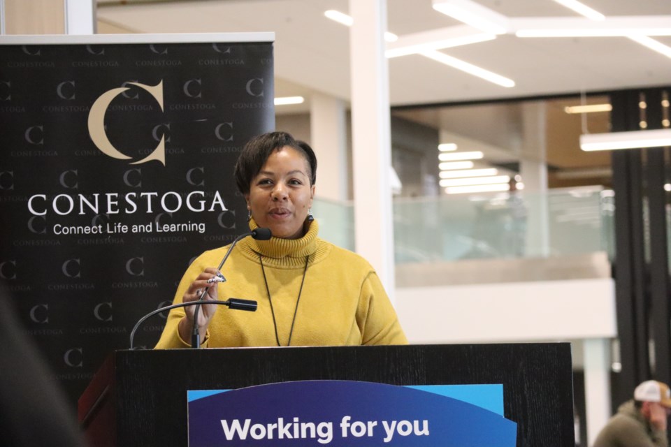 Charmaine Williams, associate minister of women’s social and economic opportunity speaks to the crowd at Conestoga College on Wednesday morning.