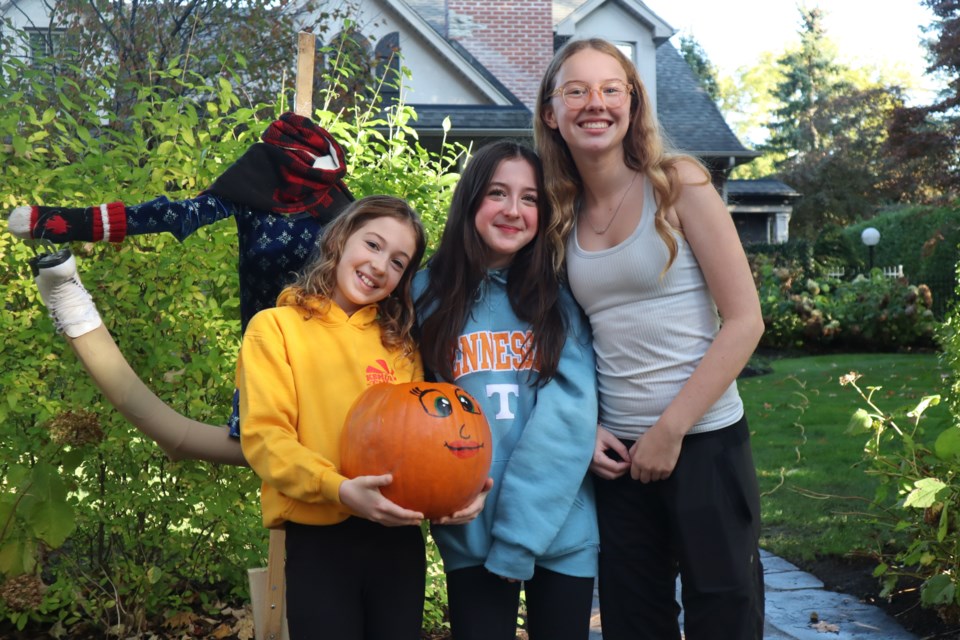 The Williams get ready to finish their pumpkin skater 