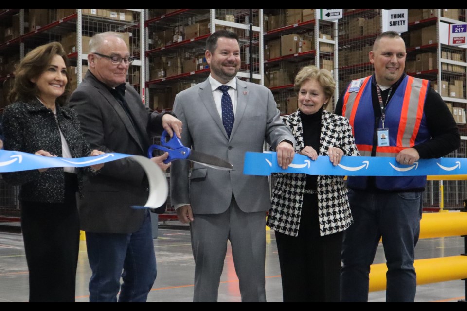 Cambridge city councillor Helen Shwery (left), Cambridge MPP Brian Riddel, Kitchener MPP Mike Harris, Regional chair Karen Redman and site manager Greg Clutton cut the ribbon at the opening ceremonies 