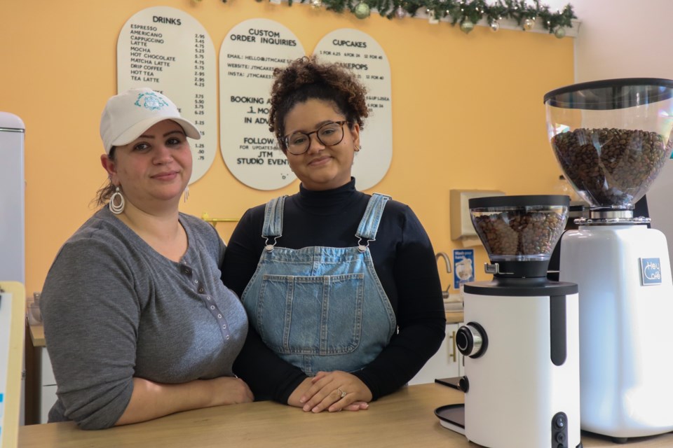 JTM bakery owner Jennifer Talarico-Moodie and her daughter Brianna Moodie stand behind the counter of their new bakery on Park Hill Road. 