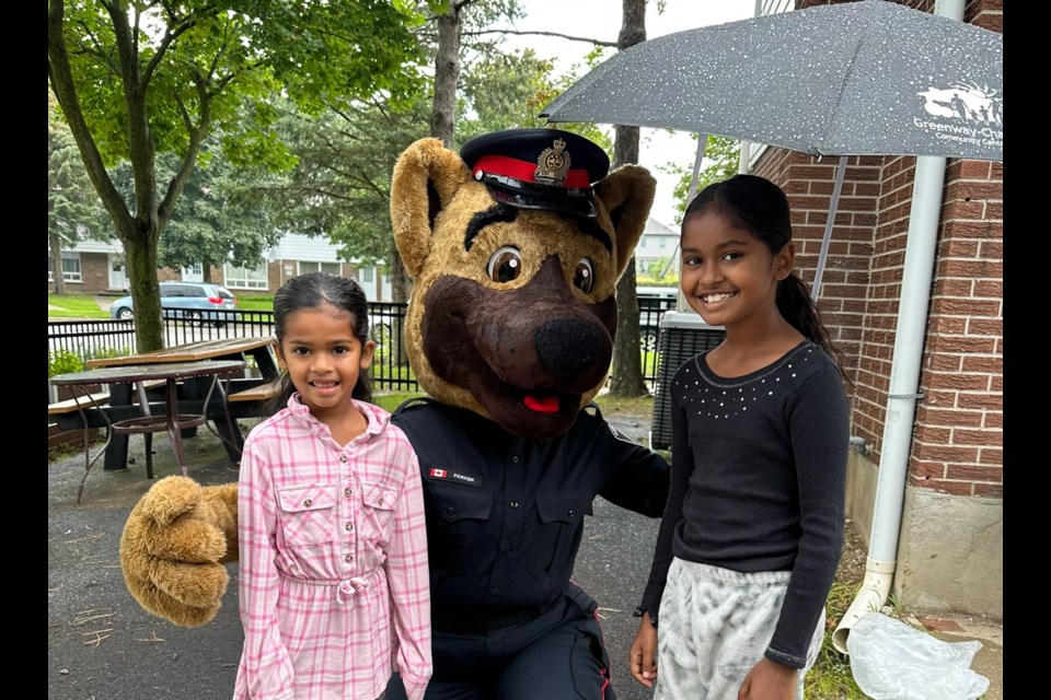 WRPS are in Cambridge helping give away backpacks and school supplies