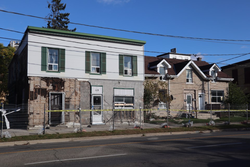 Demolition has begun on properties directly across from the Cambridge Mill parking lot. The cleared corner of of Water and Simcoe, and the properties at 115 and 113 Water St. N. will eventually be the site of a seven-storey parking garage connected by a raised walkway to condo and hotel towers.