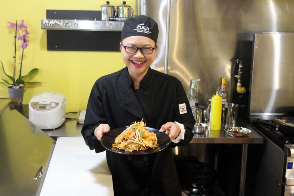 Sticky Rice owner Sirinthorn Silaphet shows off fresh shrimp pad Thai.