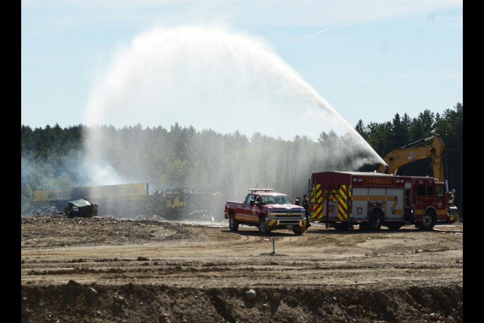 Fire crew remained on scene Sunday hosing down hot spots.