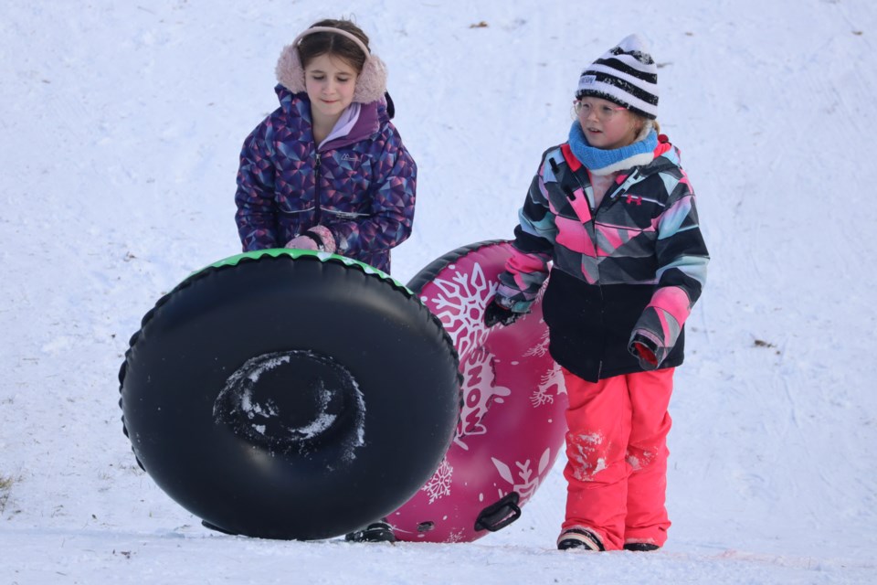 Making it back up the toboggan hill in Dickson Park.