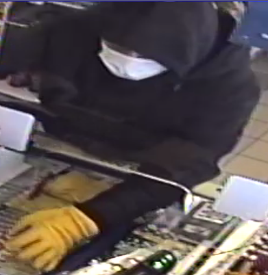 Images from security footage of the suspect in a gas station robbery on Jan. 15, 2022