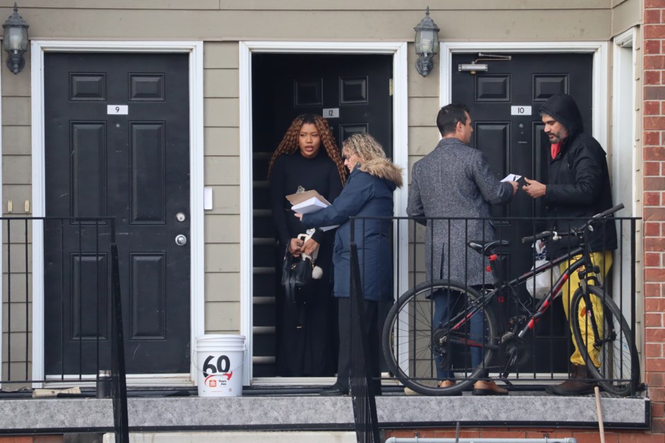 Members of the Waterloo regional police major crimes unit are canvassing neighbours at 230 Lena Cres. following a shooting last night that left a 40-year-old man dead and another with serious gunshot wounds.