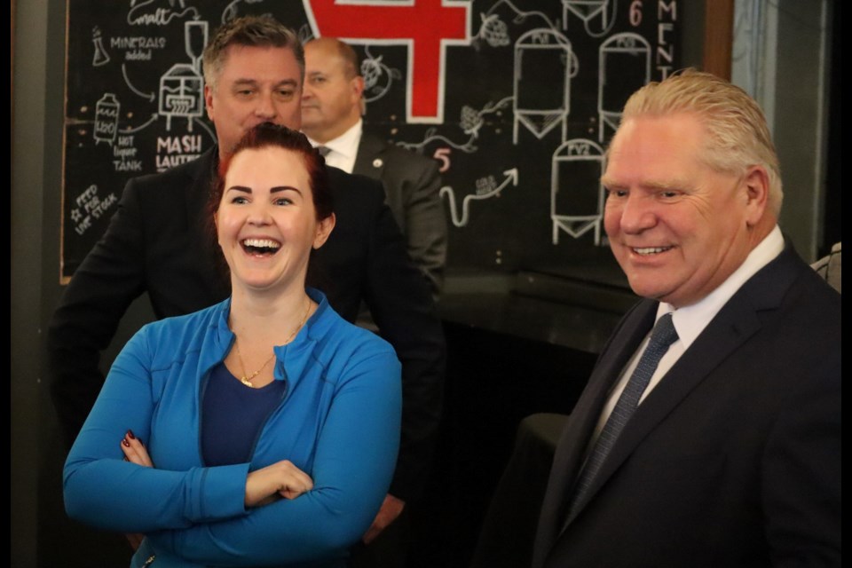 Kitchener South-Hespeler MPP Jess Dixon shares a laugh with Premier Doug Ford during his stop at Four Fathers Brewing in Cambridge.