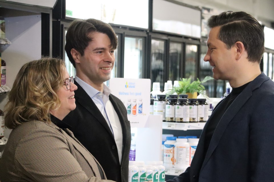 Federal Conservative leader Pierre Poilievre greets Cambridge Conservative candidate Connie Cody and Kitchener-South Hespeler Conservative candidate Matt Strauss during a stop in Kitchener on Feb. 21, 2024.