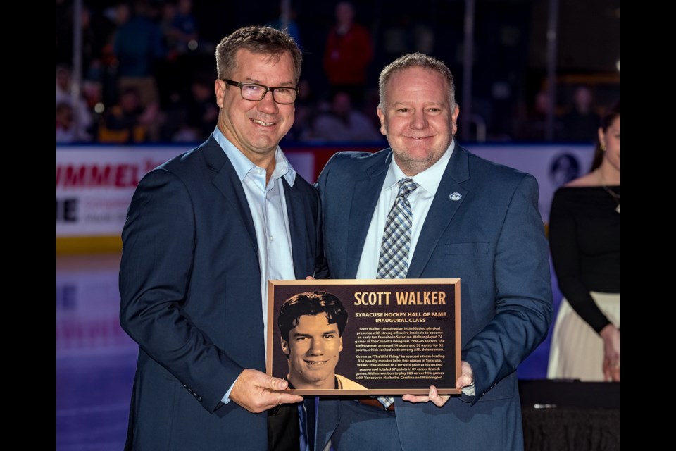 Scott Walker, left, with Syracuse Crunch chief operating officer Jim Sarosy during Walker's Nov. 23  induction into the inaugural class of the Syracuse Hockey Hall of Fame.