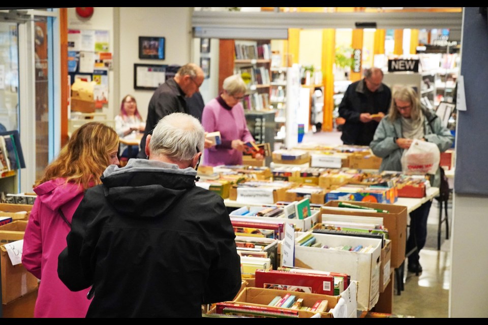 Book hunters comb through the hundreds of boxes of quality second-hand tomes at a recent book faire at Sechelt Public Library.