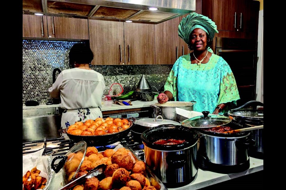 Iyabo Olaniyan in her element: cooking Nigerian fare in the guest kitchen at Gibsons Public Market.