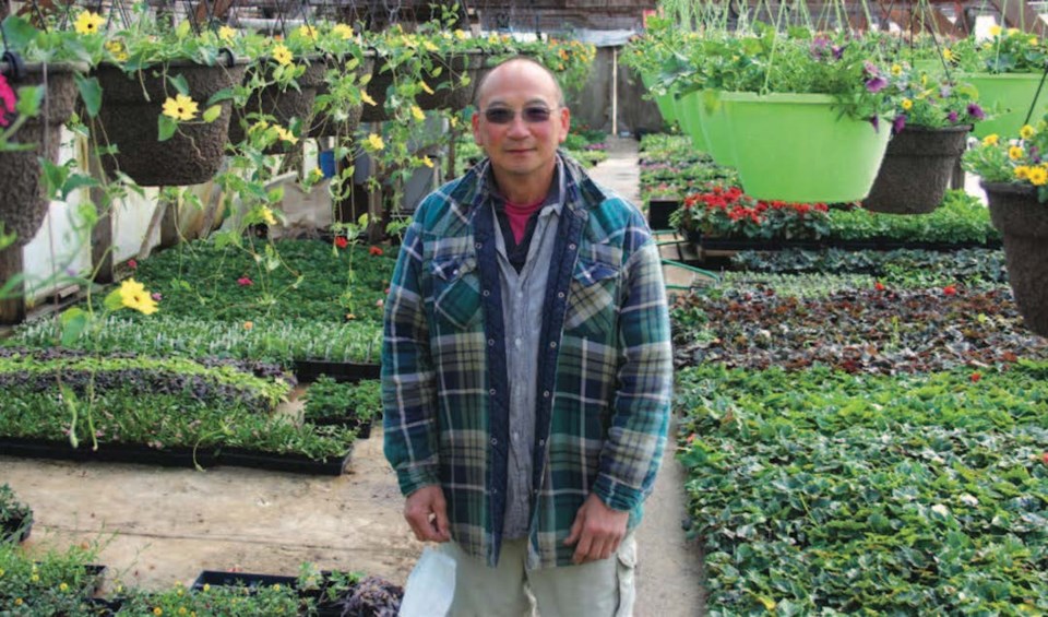 MUCH LOVED, SECOND-GENERATION B.C. FARMER, JOHN YUE IN HIS NATURAL HABITAT.