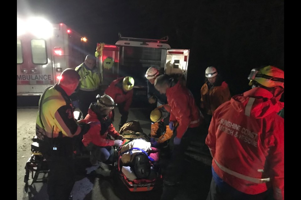 Sunshine Coast Search and Rescue members attend to an injured mountain biker, Jan. 17.