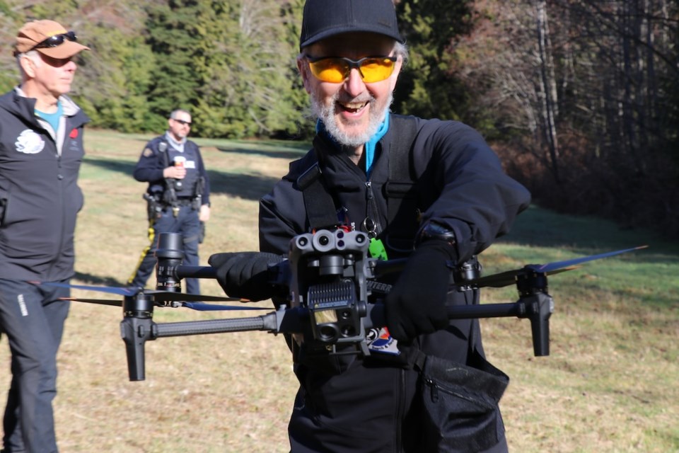 Sunshine Coast Search and Rescue drone team member Alec Tebbutt handles the drone after a demonstration flight. 