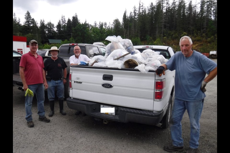 Members of the Pender Harbour Hikers with refuse collected from an annual back roads clean up event. 