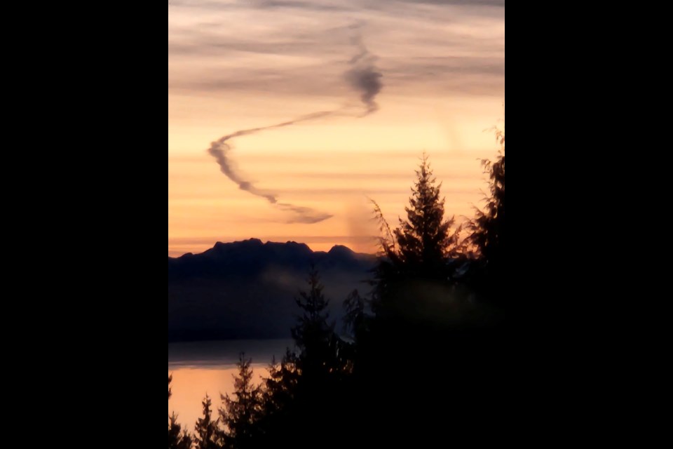 A strange "spiraling" trail of smoke was seen over the Sunshine Coast.