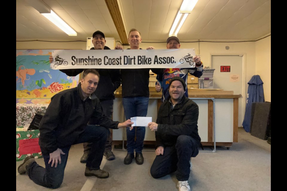 Braaapy Holidays Fundraiser: This December, three local off-road clubs partnered to raise funds for the Sunshine Coast Community Services (Sechelt) food bank. Together, the Sunshine Coast Sledders, Sunshine Coast Off-Road 4x4 Club and the Sunshine Coast Dirt Bike Association raised $1,150. The funds were presented to Chris Hergesheimer of the Sechelt food bank. Thank you to everyone who donated! In the picture from left to right back: Seth (Sledders), Tyler (Sledders) and Tom (SCDBA). Front row: Tony (SCDBA) presenting a cheque to Chris, Sunshine Coast Food Bank. 