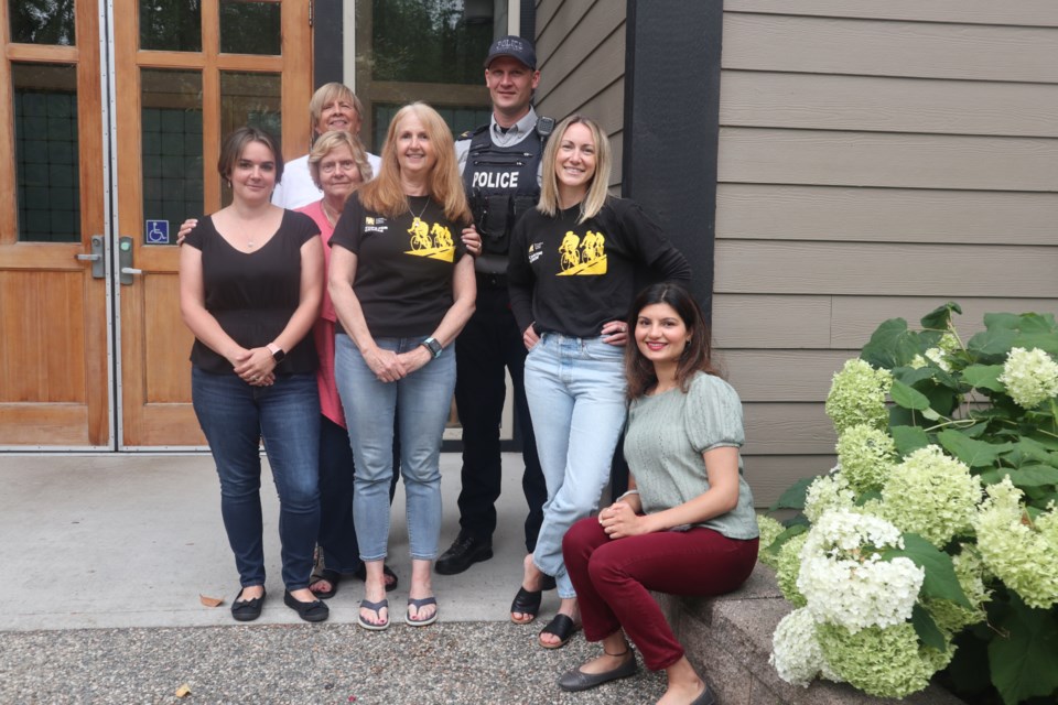 The 2024 Red Serge Gala organizing group in front of this year's gala venue, Holy Family Church Hall  (l to r Rebecca, Patti, Catherine, Lisa, Mark, Kristi and Urmi)                             