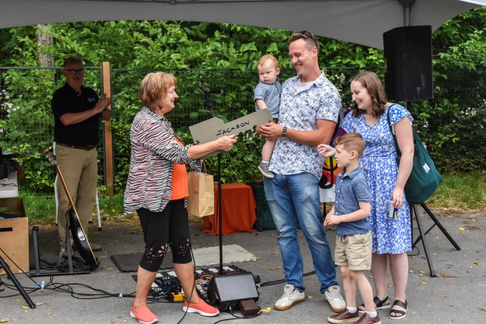 Margie Garrard presented the Jackson family with a ceremonial key to their new home.