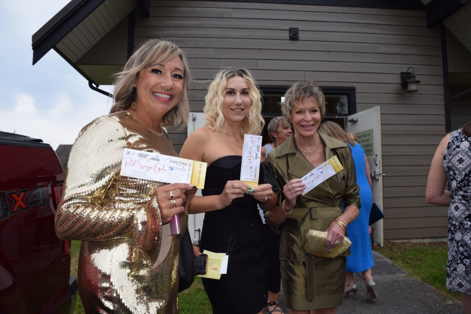 Mary, Samantha and Diane, with tickets in hand, are stoked for a special evening.