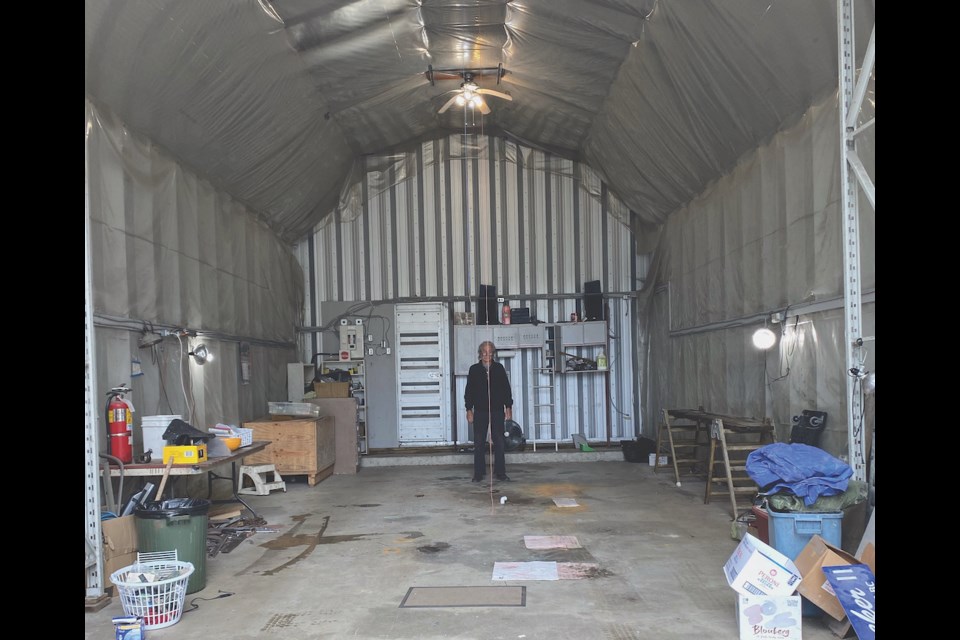 Brian Portman stands inside his emptied workshop. April 5, the Portmans discovered thieves had stolen all of the retired boatbuilder’s tools.