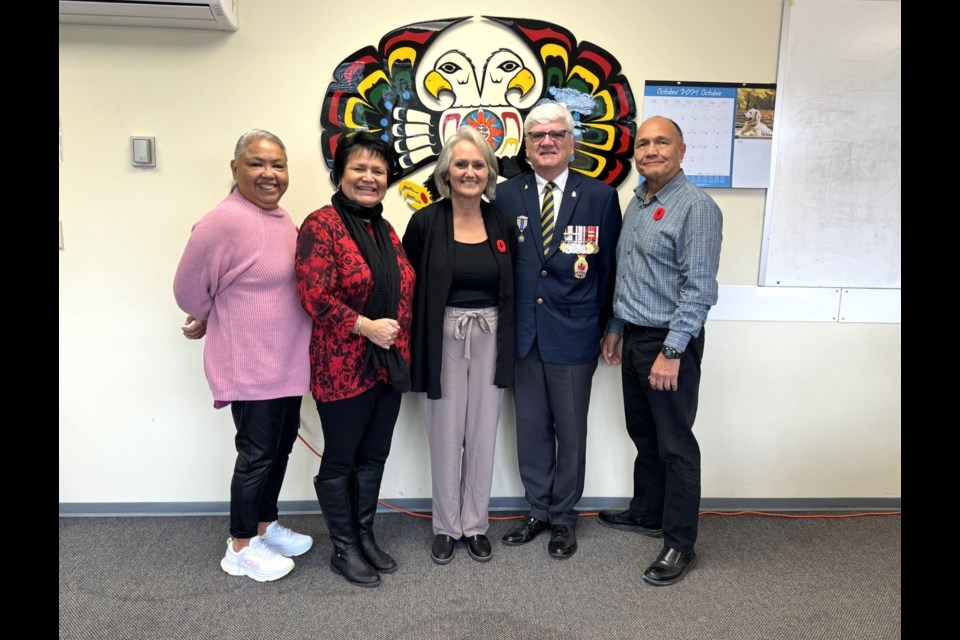 Sechelt Legion president Bill McLean (second from right) was at shíshálh Nation Tuesday, to present 'first poppies' to hihiwus (councillor) oshale (Rochelle Jones), hihiwus ch’elkwilwet (Raquel Joe), lhe hiwus yalxwemult (Chief Lenora Joe) and hihiwus tituya (Keith Julius).