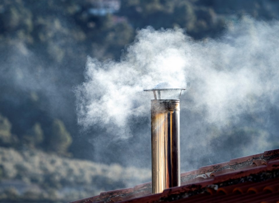 smoking-winter-chimney-on-a-roof