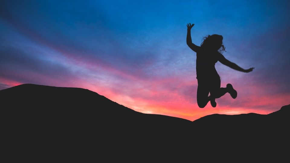 someone-jumping-against-a-sunset-happiness