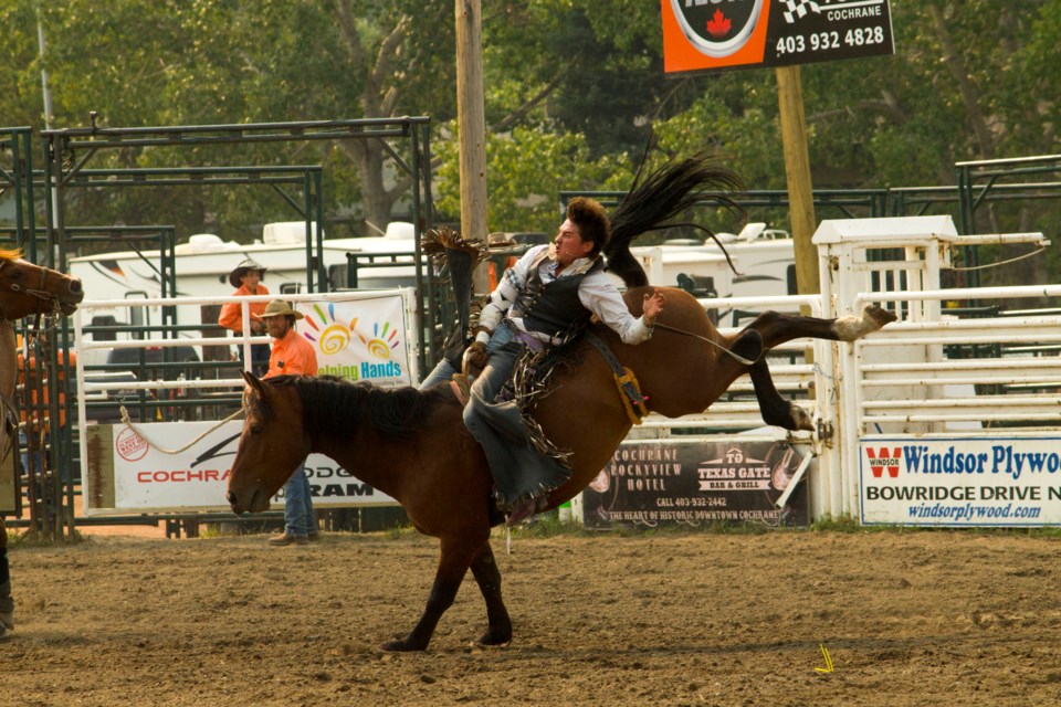 Dallas Youngpine participates in the bareback riding event at the 2022 Cochrane Rodeo held on Sept. 3.