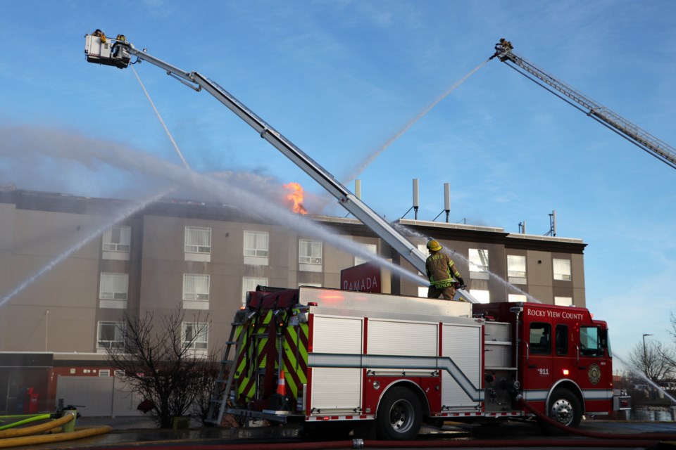 Crews from Cochrane Fire Services, Rocky View County, Redwood Meadows and the Calgary Fire Department respond to a blaze at the Ramada Hotel in Cochrane Feb. 6. (Jessica Lee/The Cochrane Eagle)