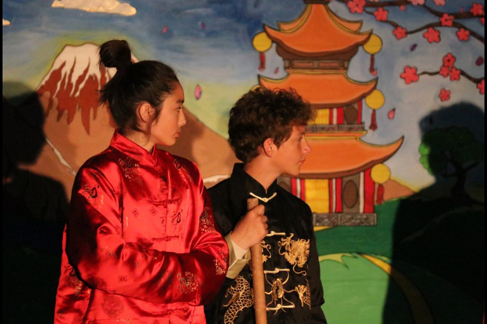 Ryuji MacKay, left, and Colton Hambrook act in a scene of Westbrook School's year-end production of Mulan June 9. The play was acted out by students in Grades 7 and 8 but also included short performances by the rest of the school's students dispersed between scenes. (Jessica Lee/The Cochrane Eagle)