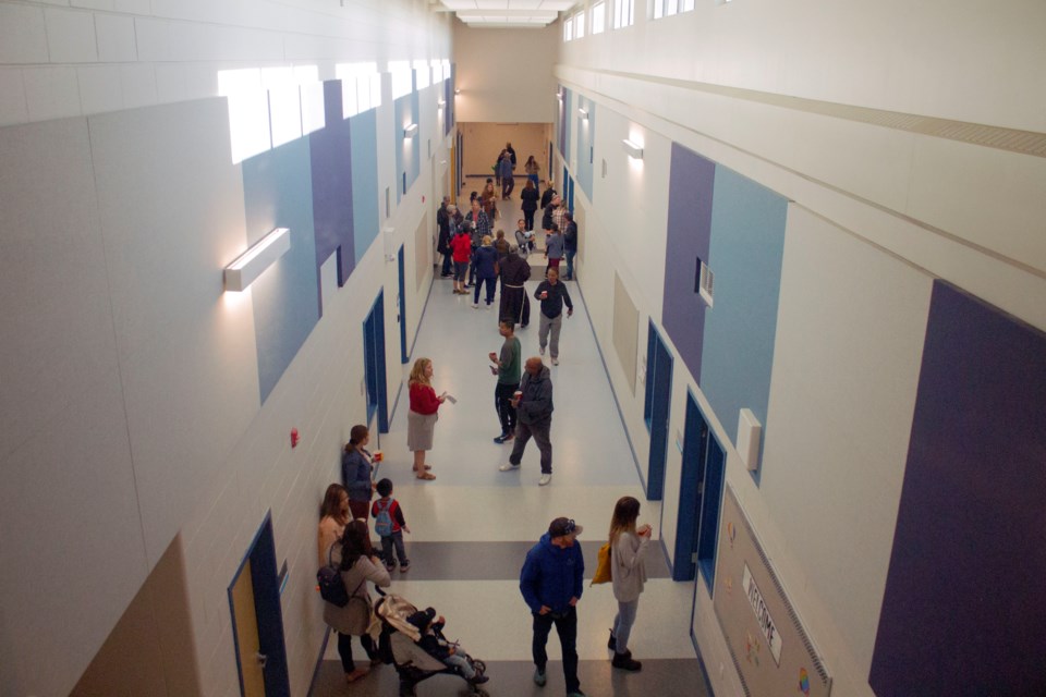 Parents touring the new school and facilities of Holy Spirit School on Sept. 6.