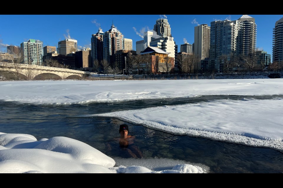 Swiss extreme athlete Andre Belibi plans to undertake a 120 kilometre run from Calgary to the Icefields Parkway on April 22 and 23. Belibi is seen taking a dip in the Bow River in Calgary.