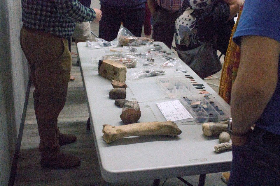 Several artifacts that attendees had the chance to examine in closer detail from the Highway 1A and Highway 22 archaeological survey that took place in Cochrane from 2018 to 2020.