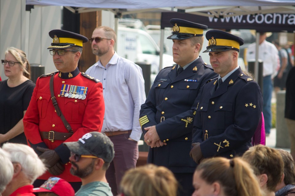 RCMP officials, political dignitaries, and members of the community partook in a ribbon cutting event to celebrate the opening of the new Cochrane Protective Services building on July 15.